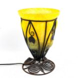 An Art Nouveau wrought-iron and yellow marbled glass lamp, height 31cm, diameter 21cm