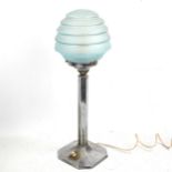 An Art Deco chrome plate table lamp, with original blue glass shade, height 45cm Good original