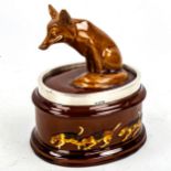 Royal Doulton pot and cover surmounted by a fox, with foxhound decorated surround and silver rim,