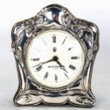 An Art Nouveau style silver framed clock