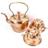 A large Victorian copper kettle, and 2 copper jelly moulds (3)