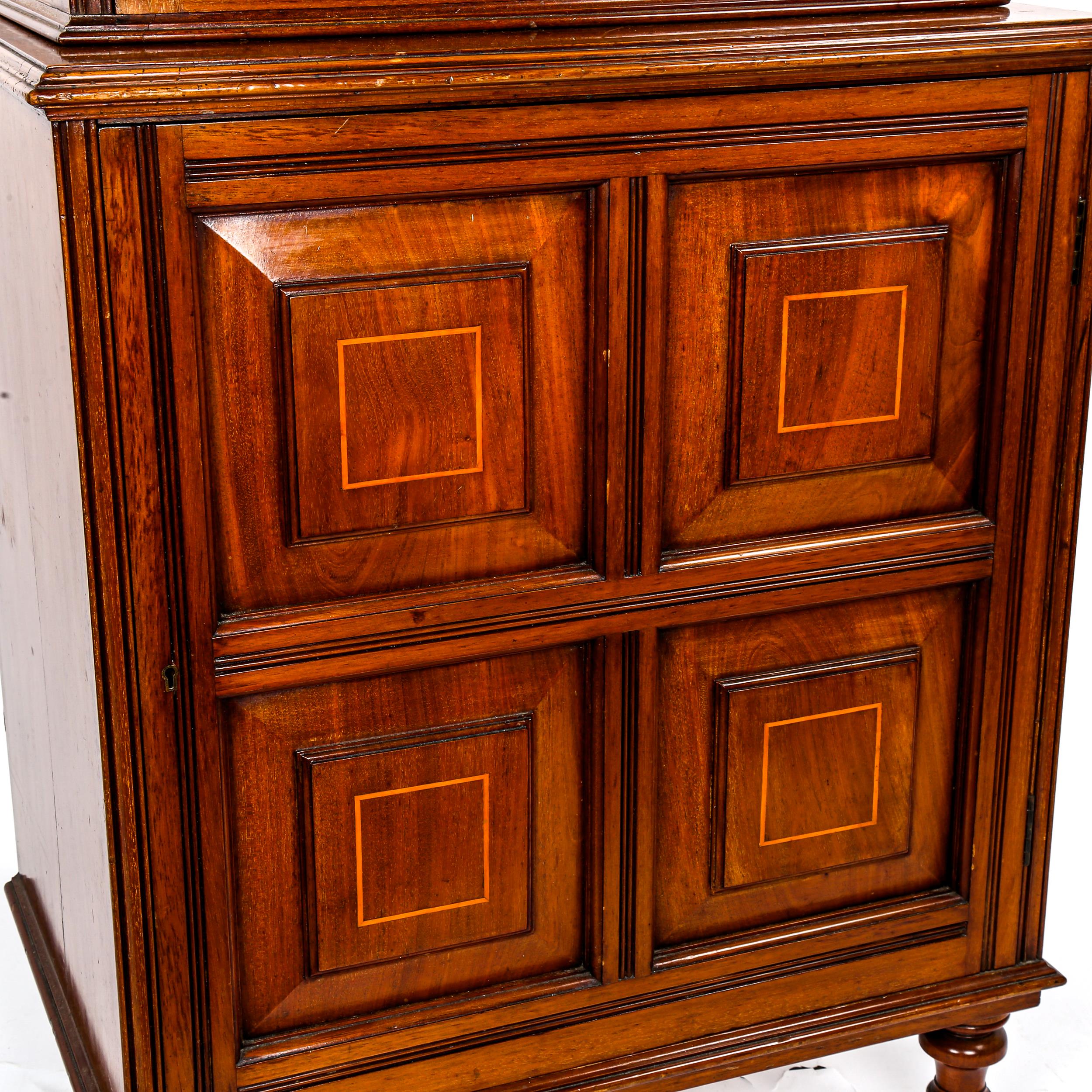 A late Victorian narrow mahogany bookcase, with fielded panelled cupboard below, width 66cm, - Image 2 of 3