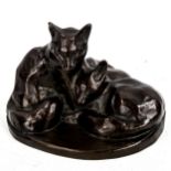 A patinated bronze sculpture, foxes and cubs, early to mid-20th century, height 12cm, diameter