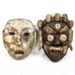A carved hardstone mask, height 23cm, and an Oriental brass-mounted carved wood mask (2)