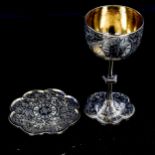 A Victorian silver-gilt communion goblet and matching wafer dish, with engraved decoration,