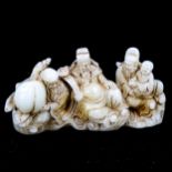 A Chinese white jade carving, depicting a group of seated figures, length 16cm, height 8cm