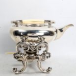A large 19th century German unmarked white metal spirit kettle on burner stand, squat ovoid form
