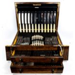 A canteen of Unity Old English pattern cutlery and servers for 12 people, in an oak cabinet with 2