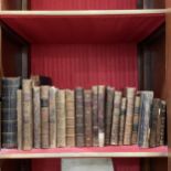 A group of Antiquarian leather-bound books, including travel writing classics and poetry