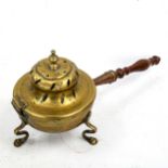 A 19th century brass chestnut roasting pan with wooden handle, overall length 34cm