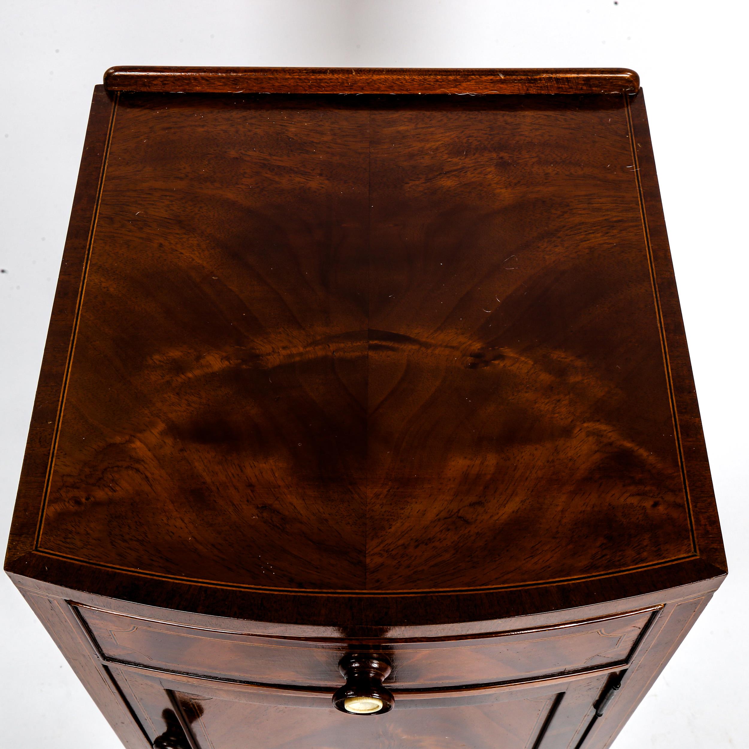 An Edwardian mahogany bow-front bedside cupboard, with frieze drawer and ivory-mounted handles, - Image 2 of 3