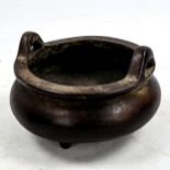 A Chinese patinated bronze incense burner, impressed seal mark under base, diameter 14cm