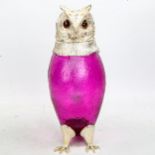 A purple glass and silver plate owl design Claret jug, with hinged head and glass eyes, height