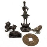 A group of Oriental bronzes, including a lamp base supported by a bird, height 25cm (5)