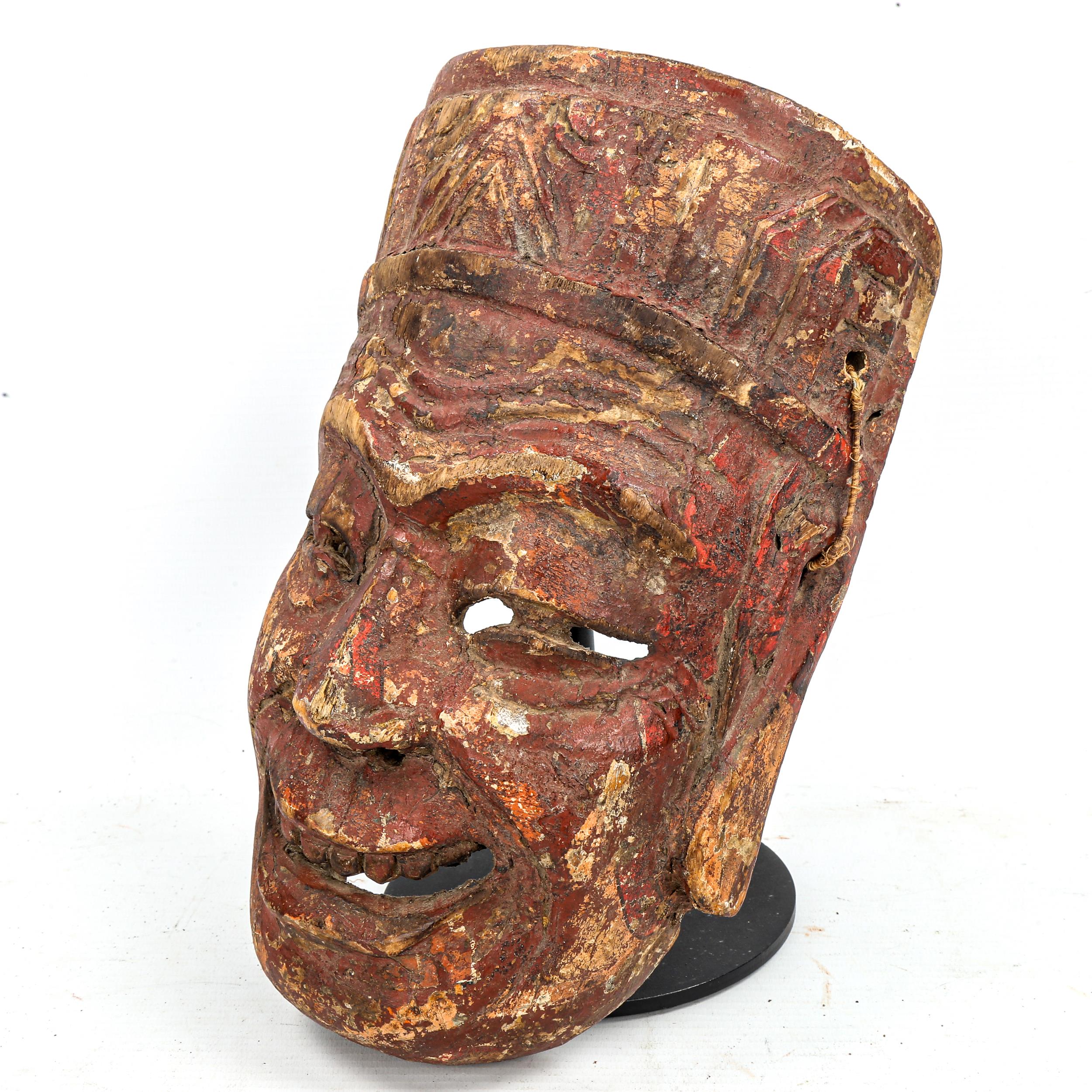 A Chinese Nuo opera mask of Tudi Gong, relief carved and painted wood, on wooden stand, height - Image 2 of 3