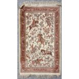 A Qum Persian silk rug, hunting scene decoration 114 x 69cm No holes or tears.