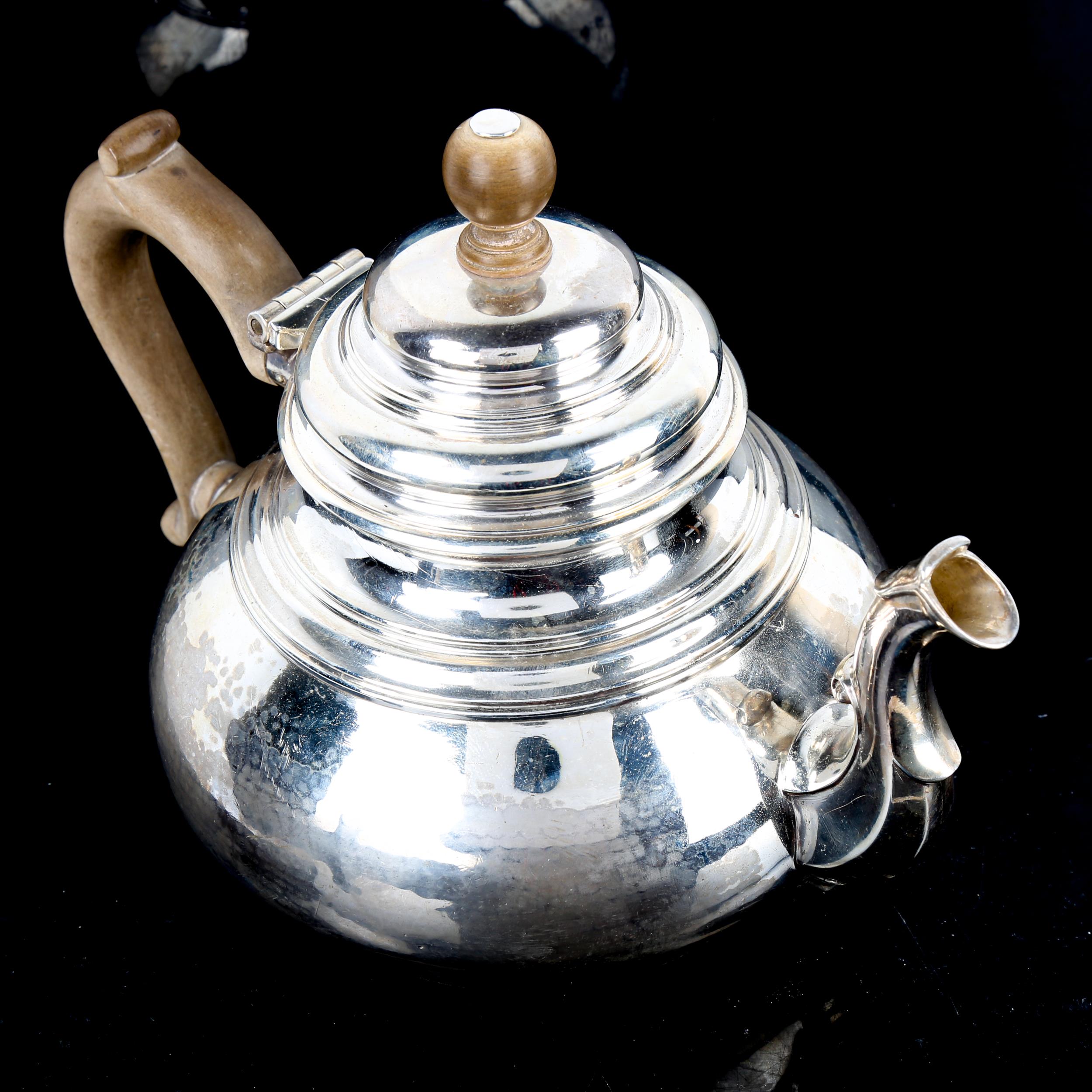 A George V silver squat teapot, in Queen Anne style, with scrolled spout, planished finish and - Image 4 of 4