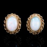A pair of late 20th century 9ct gold opal stud earrings, cable and rope twist design with oval