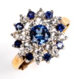A late 20th century 9ct gold blue and white sapphire snowflake cluster ring, set with round cut