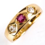 A mid-20th century 18ct gold 3-stone ruby and diamond gypsy ring, set with old-cut ruby and