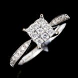 A modern 9ct white gold diamond square cluster ring, set with modern round brilliant-cut diamonds,