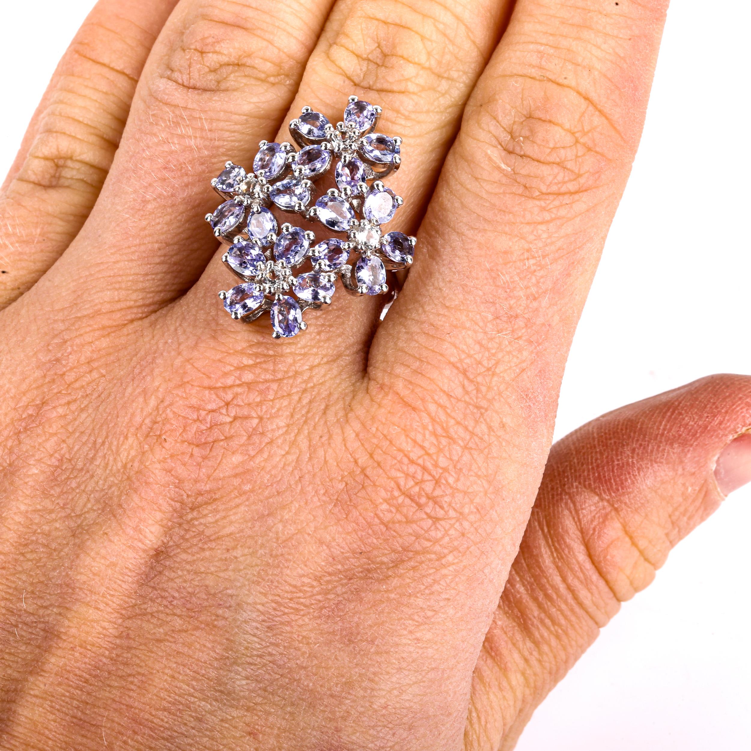 A large modern sterling silver tanzanite and cubic zirconia flowerhead ring, set with oval-cut - Image 4 of 4