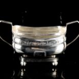 A George III Irish silver two-handled sugar bowl, bulbous form with bright cut engraved decoration