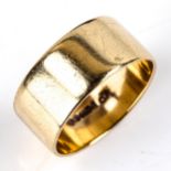 A late 20th century 9ct gold wedding band ring, band width 9.5mm, size T, 6.1g No damage or repairs,