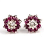 A pair of 9ct gold ruby and diamond cluster earrings, set with round cut gemstones with stud