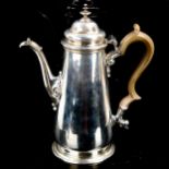 A George II silver coffee pot, tapered cylindrical form with turned wood handle and scrolled