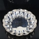 A large George V silver strawberry dish, lobed circular form, by William Comyns & Sons Ltd (