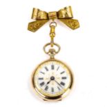 A 12.5ct gold enamel lapel fob watch, white enamel dial with Roman numeral hour markers, gilded