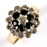 A late 20th century 9ct gold sapphire and diamond cluster ring, setting height 15mm, size O, 4.2g No