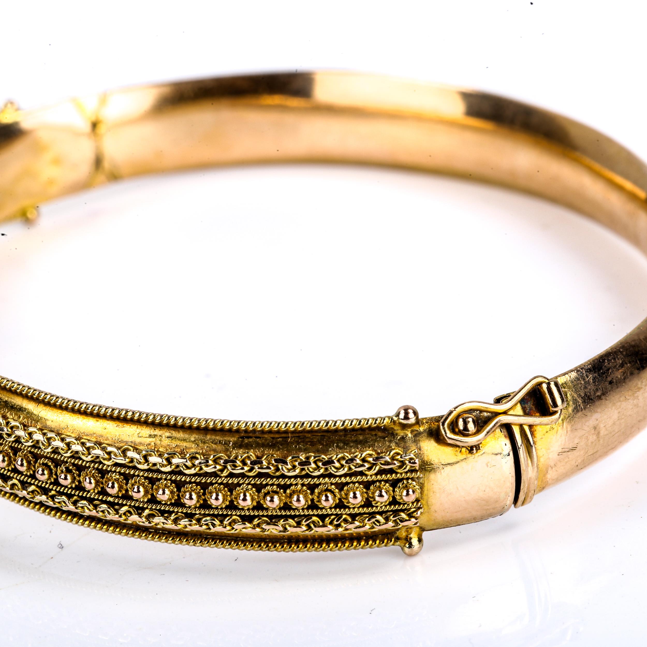 A late 20th century 9ct gold Etruscan style hinged bangle, cannetille and rope twist decoration, - Image 4 of 4