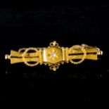 An Edwardian 15ct gold diamond bar brooch, rope twist and bead decoration with old-cut diamond,