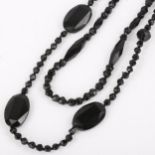 2 x jet necklaces, lengths 36cm and 56cm, 45.4g total (2) A few beads have small chips but no