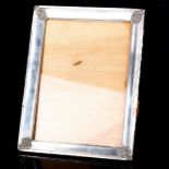 A Peruvian silver-fronted rectangular photo frame, overall 27cm x 21cm, internal dimensions 22cm x