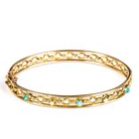 A Victorian 9ct rose gold turquoise and pearl hinged bangle, openwork twist settings, band width 7.