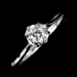 A late 20th century 18ct white gold 0.3ct solitaire diamond ring, illusion style setting with modern