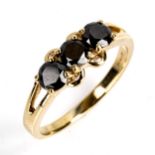 A modern 9ct gold 3-stone black diamond ring, set with modern round brilliant-cut eradiated