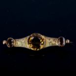 A Victorian Scottish Cairn Gorm citrine brooch, unmarked yellow metal settings with engraved foliate