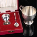 A George V silver christening mug, by Harrods Ltd, hallmarks London 1934, height 8cm, and a boxed