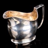 A Georgian silver cream jug, indistinct hallmarks, height 8.5cm, 3.3oz Handle has been re-