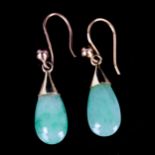 A pair of jade drop earrings, unmarked yellow metal settings with teardrop jade and shepherd hook