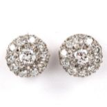 A pair of diamond cluster stud earrings, unmarked white metal settings with modern round brilliant