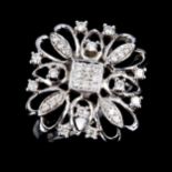 A large modern 9ct white gold diamond cluster snowflake ring, openwork settings with modern round
