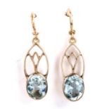 A pair of Art Nouveau 9ct gold aquamarine drop earrings, set with oval mixed-cut aquas with shepherd