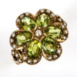 A large late 20th century 9ct gold peridot and split-pearl cluster flowerhead ring, set with oval