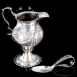 A George III silver helmet-shaped pedestal cream jug, by Nathanial Appleton & Ann Smith, hallmarks