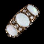 A large late 20th century 9ct gold opal and paste half hoop ring, set with oval cabochon opals and